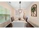Charming dining room boasts a modern chandelier, neutral walls, and ample natural light at 160 Wentworth Dr, Canton, GA 30114
