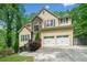 Charming two-story home with stone accents, a two-car garage, and well-maintained landscaping at 160 Wentworth Dr, Canton, GA 30114