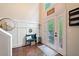 Inviting foyer with decorative wainscoting, hardwood floors, and a stylish front door with sidelights at 160 Wentworth Dr, Canton, GA 30114