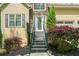 Welcoming front entrance with a decorative glass door, stylish landscaping, and inviting stairs at 160 Wentworth Dr, Canton, GA 30114