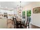 Eat-in kitchen with wood floors, modern appliances, and access to the deck at 160 Wentworth Dr, Canton, GA 30114