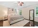 This main bedroom features a tray ceiling, ceiling fan, and large windows at 160 Wentworth Dr, Canton, GA 30114