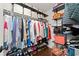 Organized walk-in closet with ample shelving, hanging racks, and hardwood floors at 160 Wentworth Dr, Canton, GA 30114