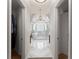 Elegant bathroom with marble walls, soaking tub, dual vanities, and a glass-enclosed shower at 1900 Chattahoochee Run Dr, Suwanee, GA 30024