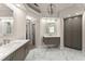 Spacious bathroom with dual vanity, gray cabinets, and marble flooring at 1900 Chattahoochee Run Dr, Suwanee, GA 30024