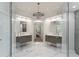 Stunning bathroom featuring dual vanities, marble floors, and a glass-enclosed shower at 1900 Chattahoochee Run Dr, Suwanee, GA 30024