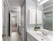 Bathroom with a single sink vanity, cabinets, and a shower-tub combo at 1900 Chattahoochee Run Dr, Suwanee, GA 30024