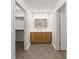 Bathroom featuring a vanity area, mirror, and entry into a walk-in closet at 1900 Chattahoochee Run Dr, Suwanee, GA 30024