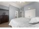 Spacious bedroom with high ceiling, carpet, and view of ensuite bathroom and closet at 1900 Chattahoochee Run Dr, Suwanee, GA 30024