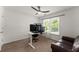 Bright bedroom with desk, comfortable chair and leather sofa at 1900 Chattahoochee Run Dr, Suwanee, GA 30024