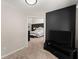Cozy bedroom showcasing an accent wall and TV at 1900 Chattahoochee Run Dr, Suwanee, GA 30024