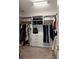 Spacious walk-in closet with custom shelving, drawers, and ample storage for clothing at 1900 Chattahoochee Run Dr, Suwanee, GA 30024