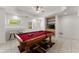 Bright game room with a pool table and tiled flooring, perfect for entertainment at 1900 Chattahoochee Run Dr, Suwanee, GA 30024