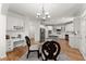 Spacious kitchen featuring an island, stainless steel appliances, and breakfast nook with chairs at 1900 Chattahoochee Run Dr, Suwanee, GA 30024