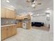 Open kitchen with tile flooring and living room area at 1900 Chattahoochee Run Dr, Suwanee, GA 30024