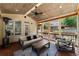 Inviting screened porch with wood flooring and ceiling, plus cozy seating and fan at 1900 Chattahoochee Run Dr, Suwanee, GA 30024
