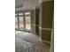 A well-lit bedroom with a large window, neutral colors, and fresh carpeting at 370 Buchanan Circle Tract 1, Dallas, GA 30157