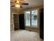 Bedroom with black doors, neutral carpeting, and a window overlooking an outdoor space at 370 Buchanan Circle Tract 1, Dallas, GA 30157