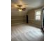 A spacious bedroom with neutral walls, plush carpeting, a ceiling fan, and ample natural light at 370 Buchanan Circle Tract 1, Dallas, GA 30157