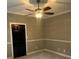 Cozy bedroom featuring a ceiling fan with light, neutral paint, and plush carpeting at 370 Buchanan Circle Tract 1, Dallas, GA 30157