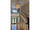 Entryway featuring wood flooring, wainscotting, a staircase with white risers and wood handrail, and a chandelier at 370 Buchanan Circle Tract 1, Dallas, GA 30157