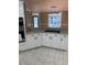 A well-lit kitchen with granite counters, modern appliances, and stylish tile flooring at 370 Buchanan Circle Tract 1, Dallas, GA 30157