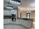Well-lit kitchen with modern appliances, granite counters, white cabinets, and an eat-in island at 370 Buchanan Circle Tract 1, Dallas, GA 30157