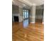 Living room featuring wood flooring, a fireplace, wainscotting, and multiple windows providing natural light at 370 Buchanan Circle Tract 1, Dallas, GA 30157