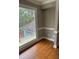 Bright room with large windows overlooking the greenery and a private deck, and hardwood floors at 370 Buchanan Circle Tract 1, Dallas, GA 30157