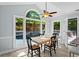 Dining area with views of pool and backyard through large arched windows allowing for ample natural light at 4794 Dalhousie Ne Pl, Marietta, GA 30068