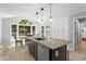 Bright kitchen features stainless steel appliances, granite countertops, kitchen island with sink and barstool seating at 4794 Dalhousie Ne Pl, Marietta, GA 30068