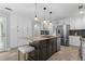 Bright kitchen features stainless steel appliances, granite countertops, kitchen island with sink and seating at 4794 Dalhousie Ne Pl, Marietta, GA 30068