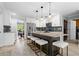 Spacious kitchen featuring a large island with seating, stainless steel appliances, and stylish pendant lights at 4794 Dalhousie Ne Pl, Marietta, GA 30068