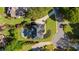 Stunning aerial view of a home showcasing its lush landscaping, pool, and meticulously maintained surroundings at 7390 Canter Run, Cumming, GA 30040