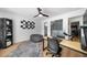 Bedroom featuring a ceiling fan, grey carpet, and a desk area at 7390 Canter Run, Cumming, GA 30040