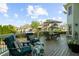 Inviting deck space with comfortable seating, perfect for outdoor relaxation and entertaining with a view at 7390 Canter Run, Cumming, GA 30040