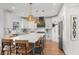 Beautiful kitchen with white cabinets, a large island with seating, and stainless steel appliances at 7390 Canter Run, Cumming, GA 30040