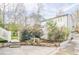 A backyard with a rock retaining wall and mature trees at 1195 Cameron Ne Ct, Atlanta, GA 30306