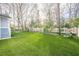 Spacious backyard with well-kept lawn and a small lawnmower at 1195 Cameron Ne Ct, Atlanta, GA 30306
