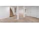 Open basement featuring carpeted floors, stairs, and white support beams at 1195 Cameron Ne Ct, Atlanta, GA 30306
