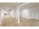 Spacious basement area with carpet, white walls, and support columns at 1195 Cameron Ne Ct, Atlanta, GA 30306