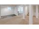 Spacious basement with carpeted flooring, large support beams, and natural light at 1195 Cameron Ne Ct, Atlanta, GA 30306