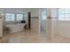 Bright bathroom featuring a freestanding tub, travertine floors and subway tile at 1195 Cameron Ne Ct, Atlanta, GA 30306