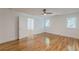 Spacious bedroom with hardwood floors, bright windows, and an open doorway at 1195 Cameron Ne Ct, Atlanta, GA 30306