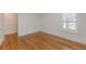Bright bedroom featuring hardwood floors and a large window with natural light at 1195 Cameron Ne Ct, Atlanta, GA 30306