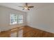 Charming bedroom with hardwood flooring, white trim, and a ceiling fan with a light at 1195 Cameron Ne Ct, Atlanta, GA 30306