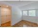 Bedroom featuring hardwood floors, a walk-in closet, and bright windows at 1195 Cameron Ne Ct, Atlanta, GA 30306