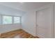 Cozy bedroom with hardwood floors, white trim, and two sunny windows at 1195 Cameron Ne Ct, Atlanta, GA 30306