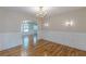Formal dining room showcases stylish lighting, wainscoting, and hardwood floors at 1195 Cameron Ne Ct, Atlanta, GA 30306