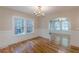 Dining room featuring hardwood floors, wainscoting, and abundant natural light at 1195 Cameron Ne Ct, Atlanta, GA 30306
